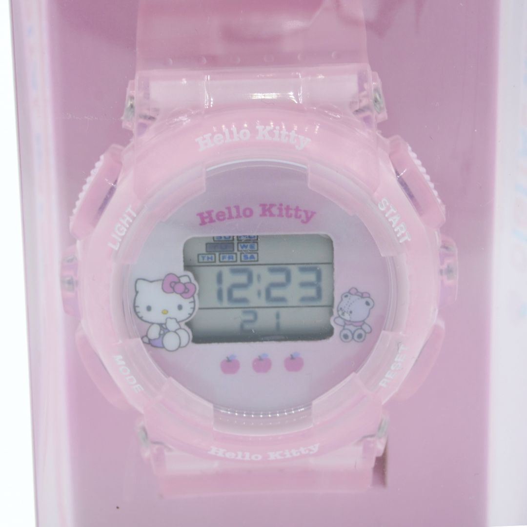 Pink digital watch with Hello Kitty design on a pink background