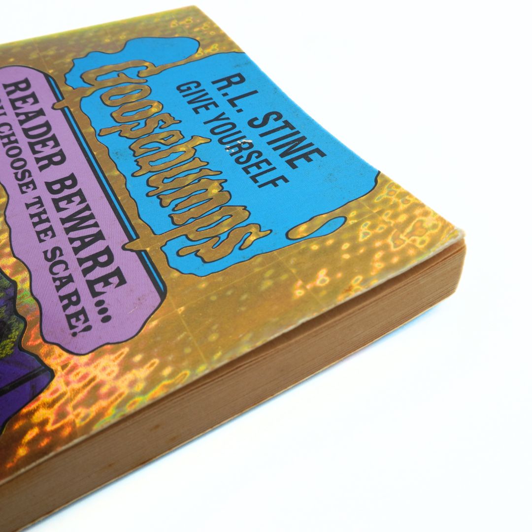 Book with colorful cover featuring text and graphics on a white background