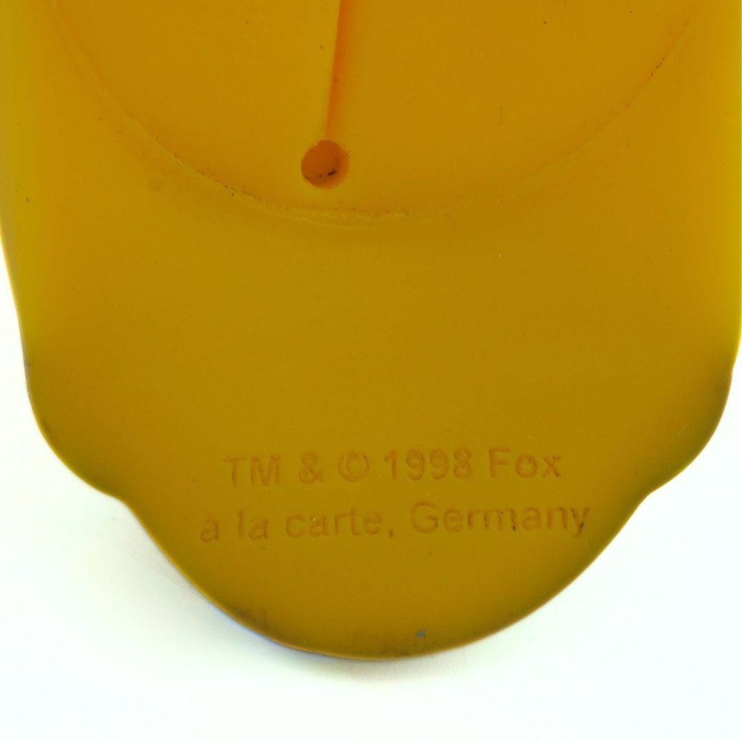 Closeup of the branding on a vintage 1998 Homer Simpson coin purse