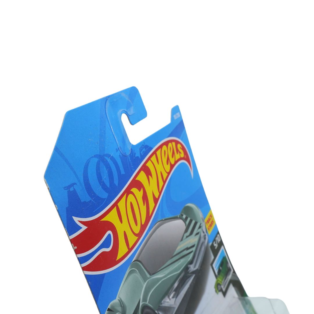 A Hot Wheels toy car in its original blue packaging card, angled diagonally against a plain white background.