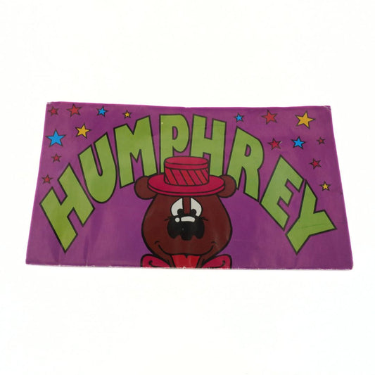 Purple and green Humphrey B. Bear height chart folded up 