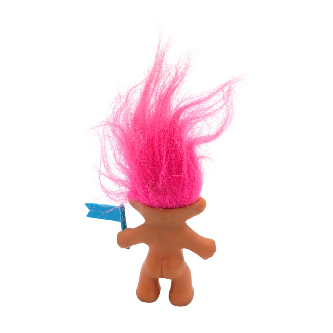 Toy figure with pink hair and a blue flag on a white background