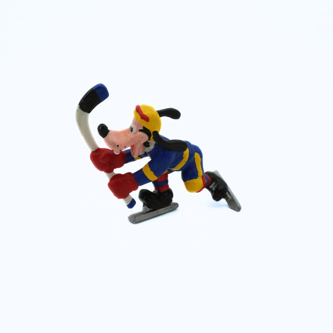 Toy figure of a cartoon character playing hockey on a white background