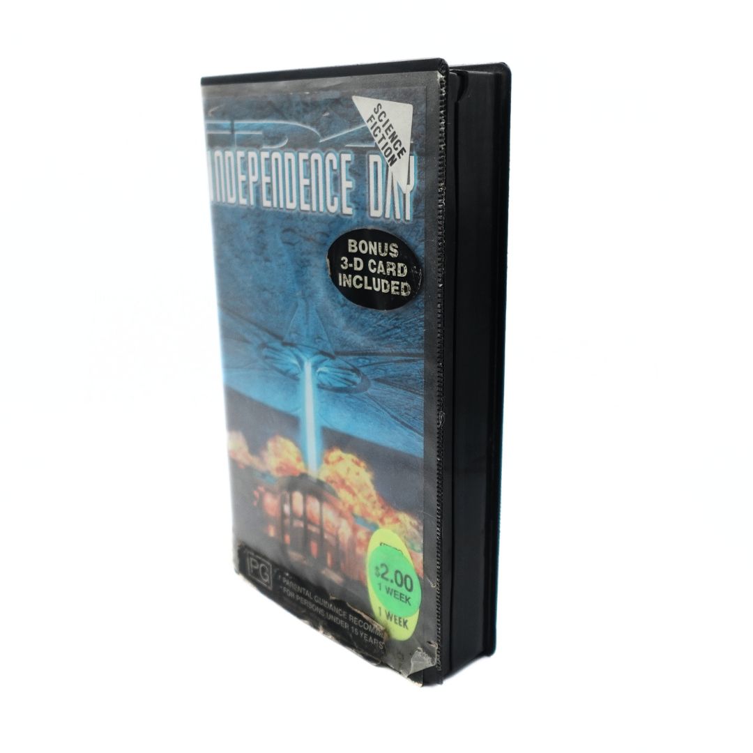 Front cover of the VHS tape Independence Day showing damage to the case and added stickers