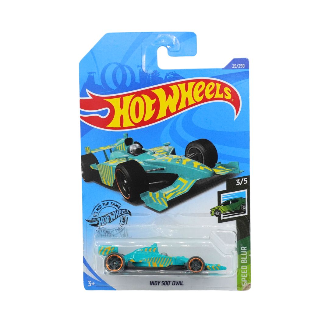 A Hot Wheels Indy 500 Oval die-cast toy car in its original blue blister card packaging, featuring a turquoise and yellow livery with black wheels.