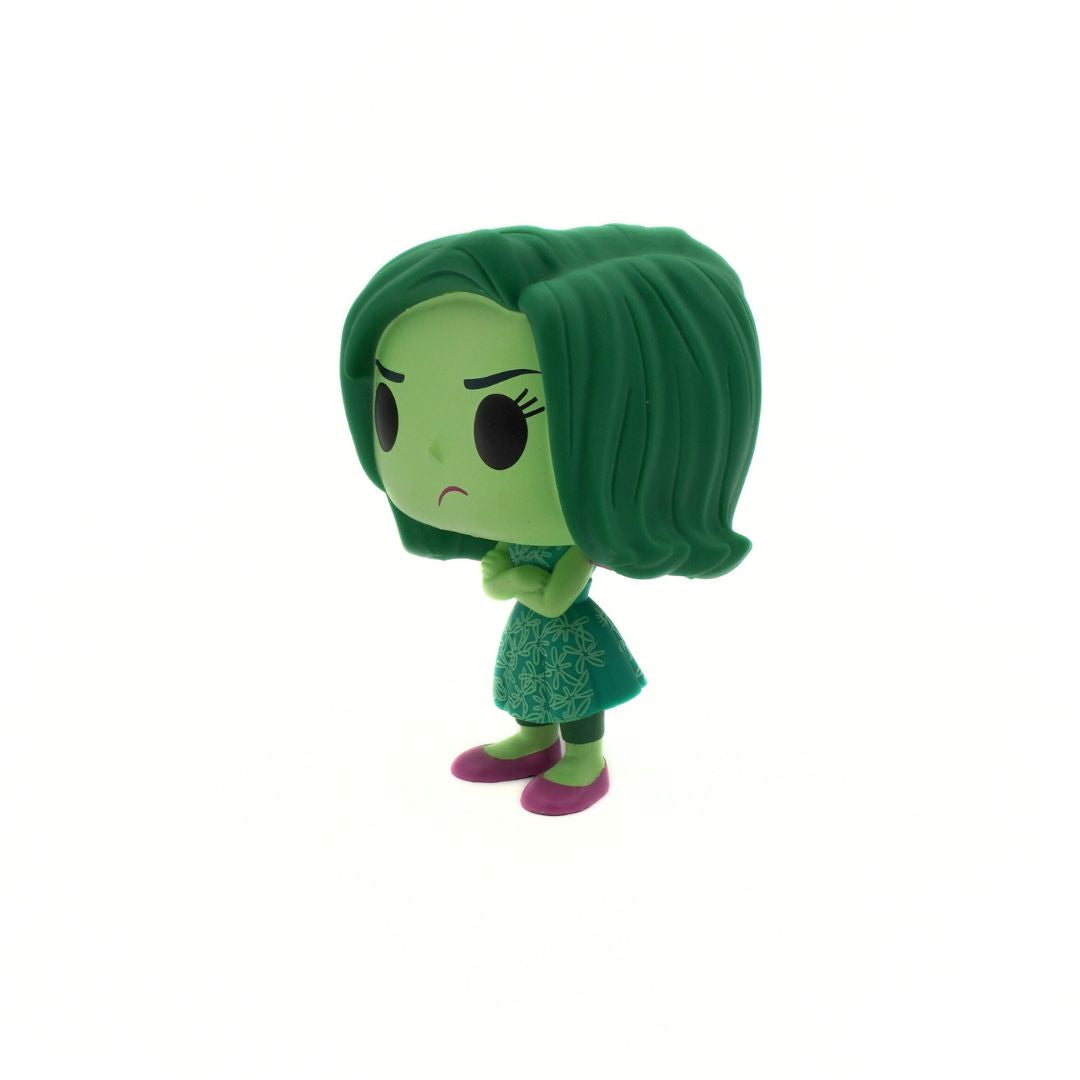 Green animated character figurine on a white background