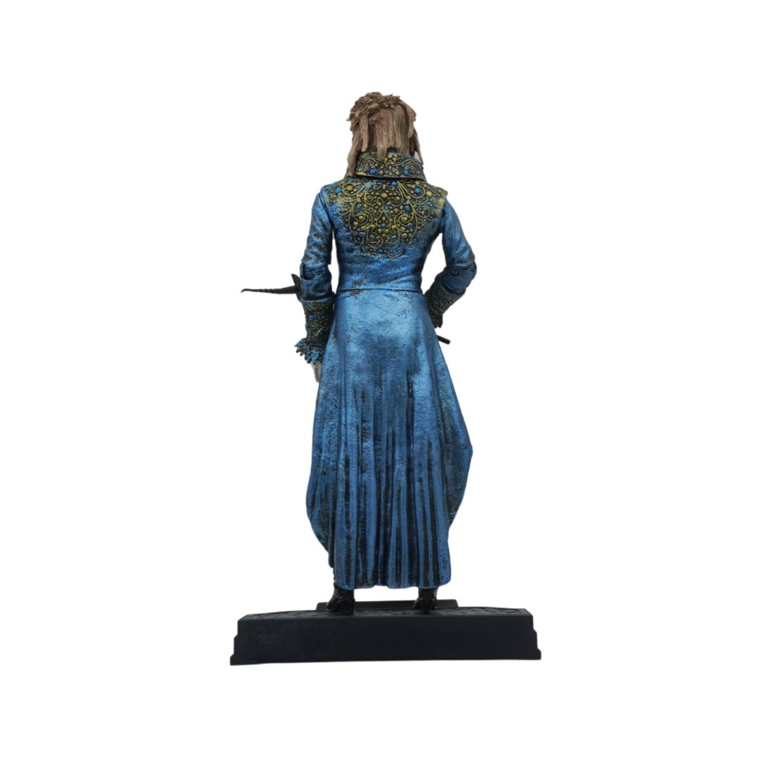 Statue of a character in a blue dress with a white background