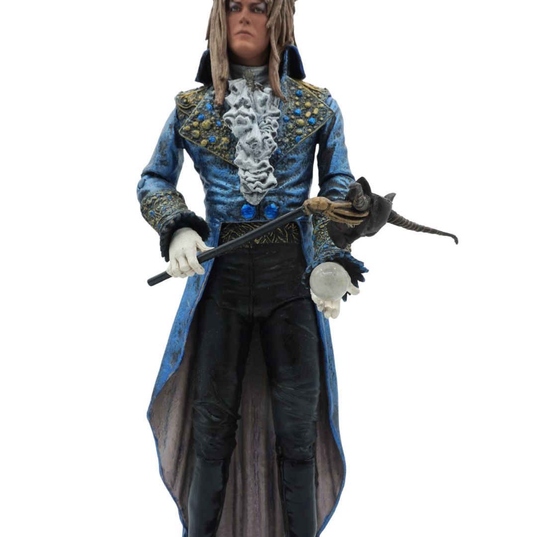 Action figure in elaborate costume with blue and black outfit on a white background