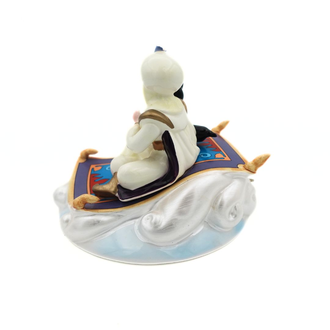 Side on angle of a 1993 Disney Aladdin music box featuring the carpet, Aladdin and Jasmine