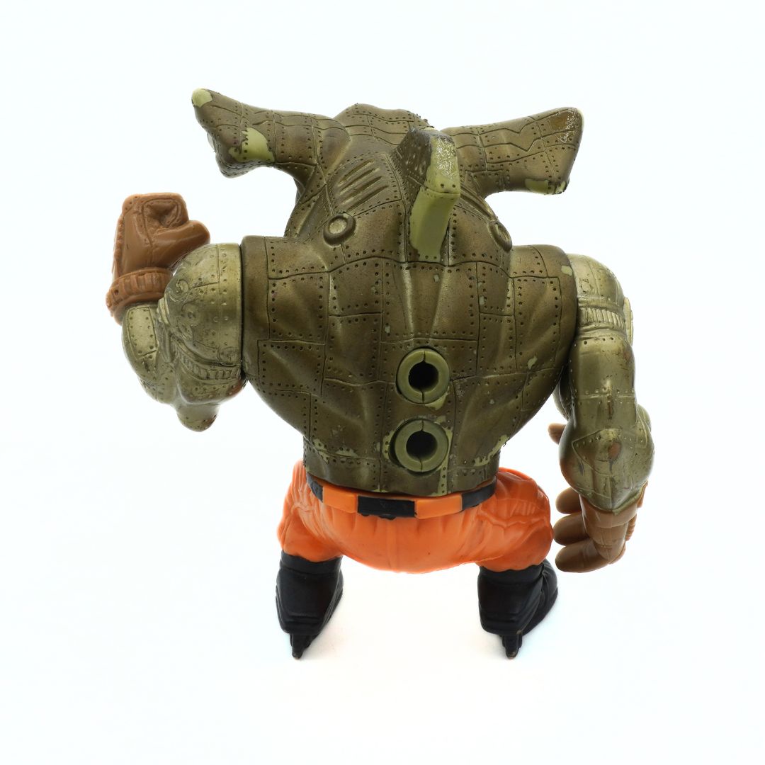 Toy figure with green armor and orange pants on a white background