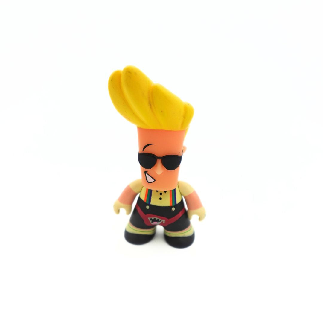 A small Johnny Bravo figure wearing a button up shirt, overalls and a bumbag