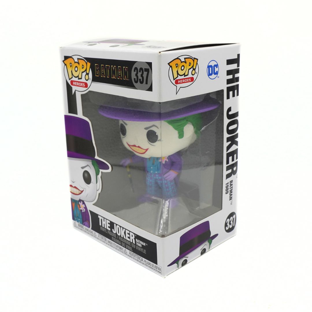 Funko Pop! Movies The Joker vinyl figure number 337 in its original white window box packaging, featuring the character with green hair, purple hat and suit, and a silver cane.