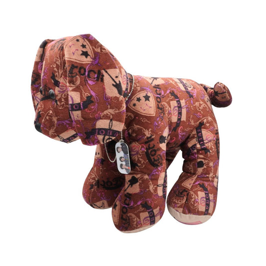 Plush dog toy with cowboy pattern on a white background