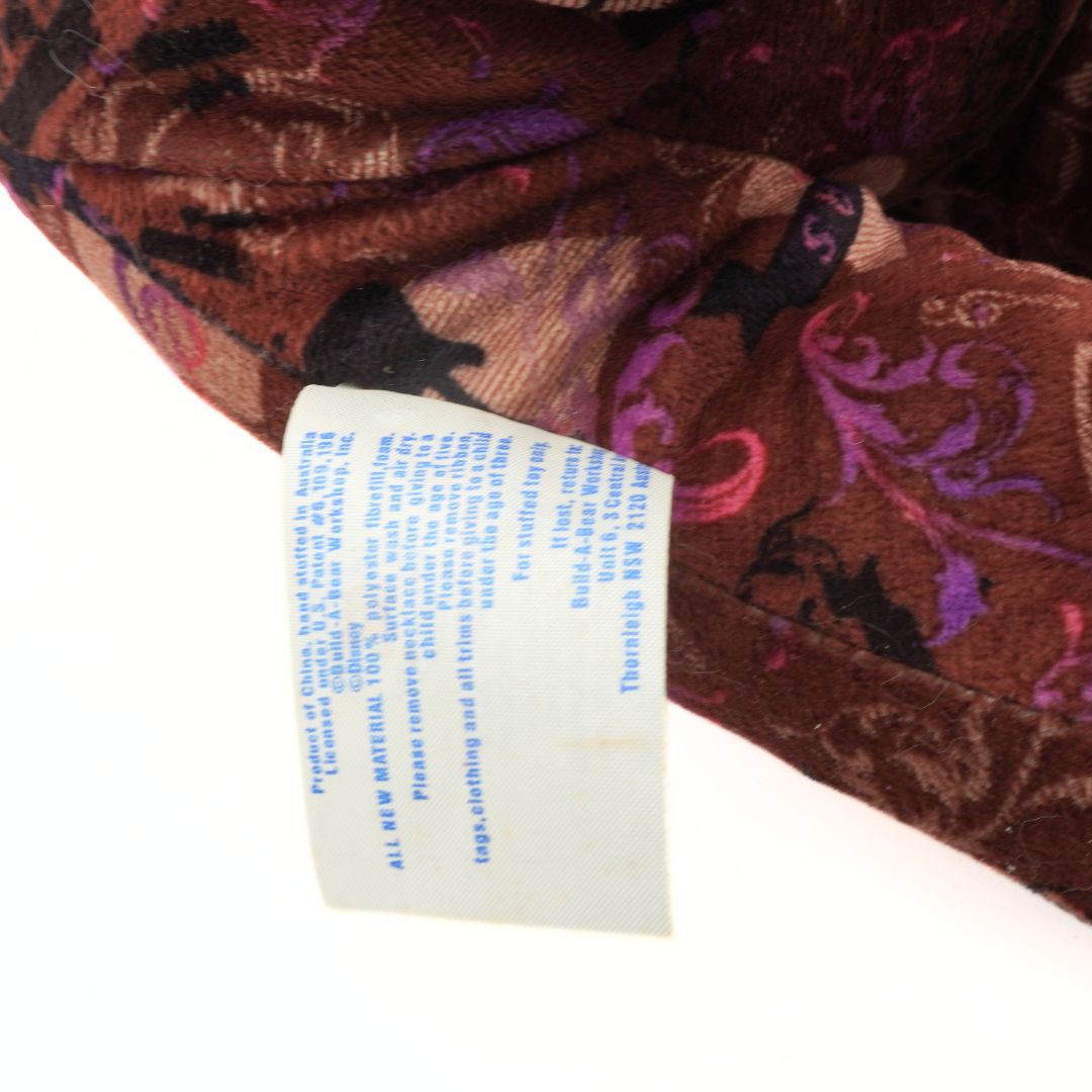 Close-up of a patterned fabric with a label on a white background
