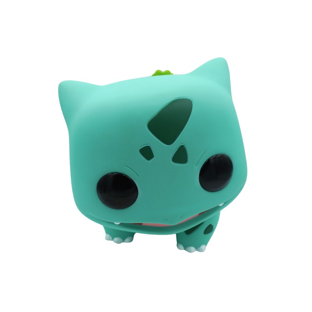 Green cartoon character toy on a white background