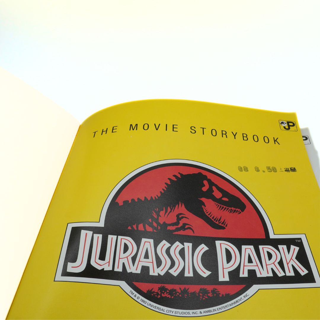 Jurassic Park movie storybook with yellow cover and dinosaur logo.