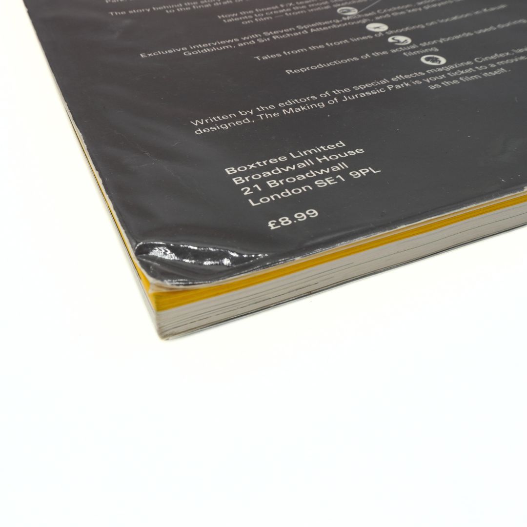 Back cover of a book with text and a price tag on a white background