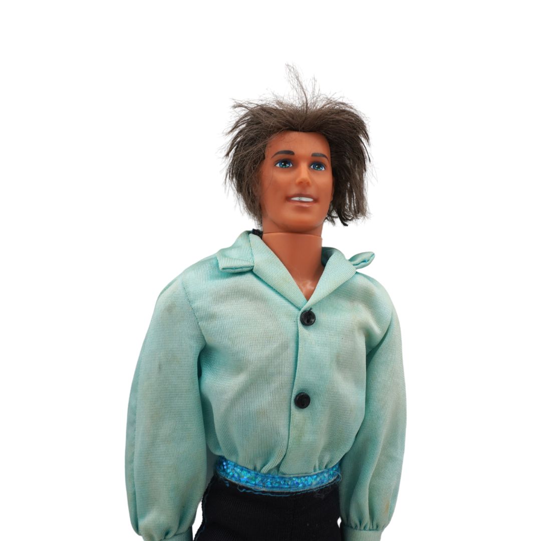 Toy figure wearing a light blue jacket on a white background