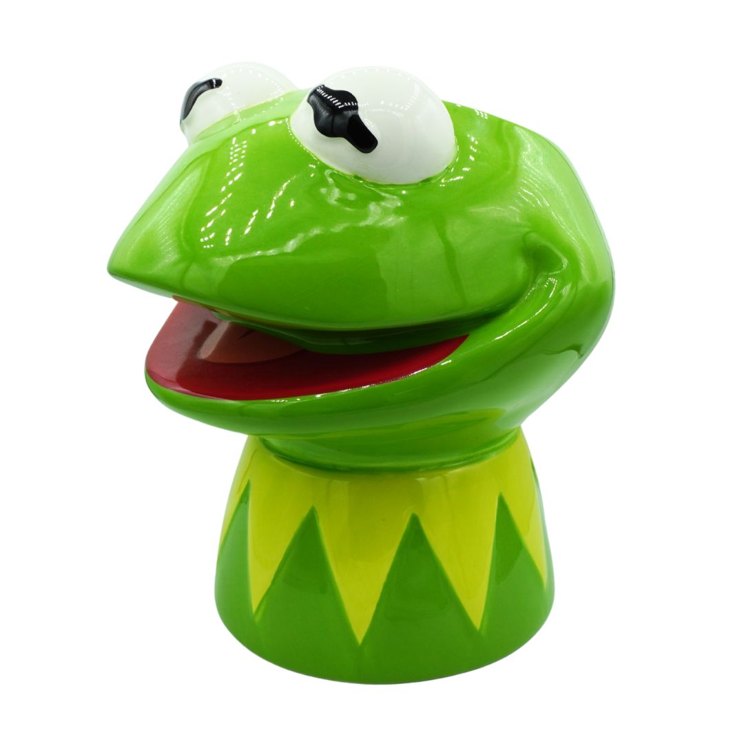 A glossy green Kermit the Frog character head and neck stand, featuring white eyes with black pupils, a red mouth interior, and yellow-green jagged collar details on a white background.