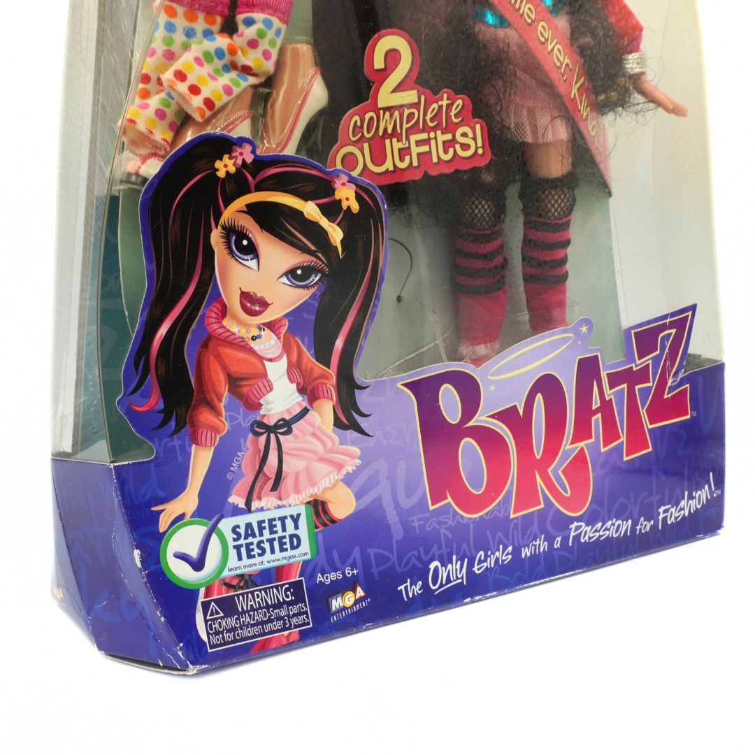 Bratz doll packaging with two complete outfits on a white background