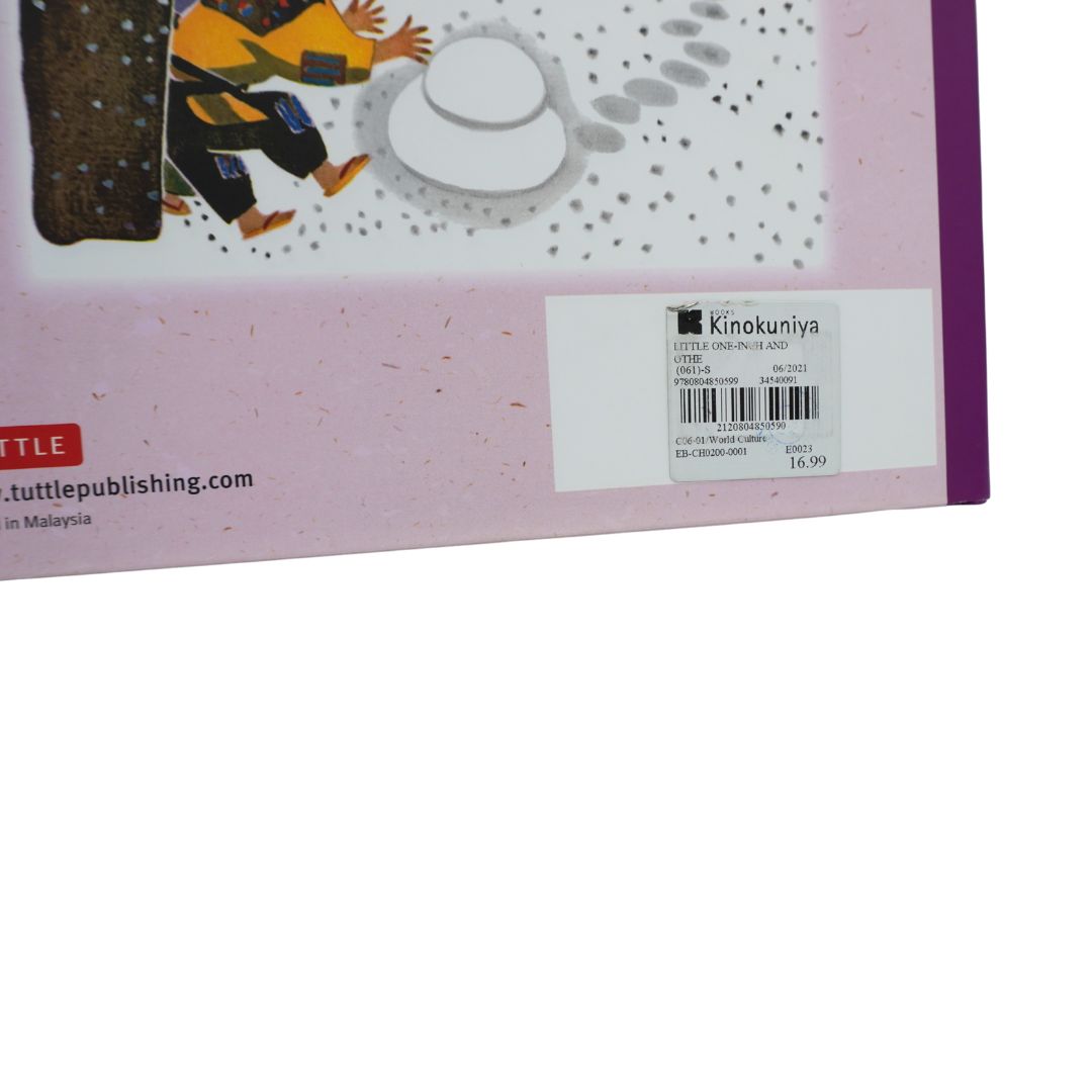 Close-up of the back cover by Tuttle Publishing, showing a pink background, a white barcode label, and part of an illustration with a person in a yellow outfit.