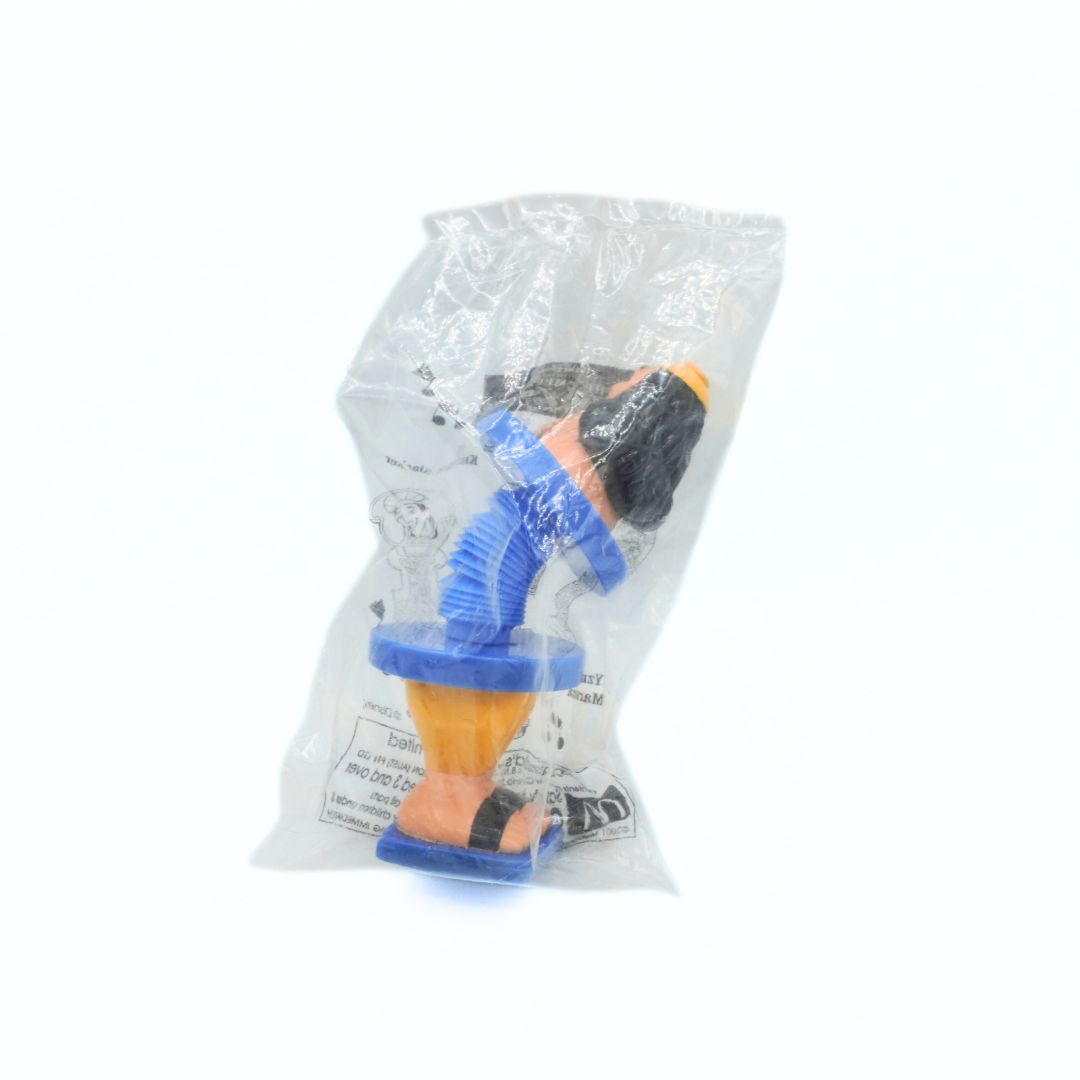 Toy figure in a clear plastic package on a white background
