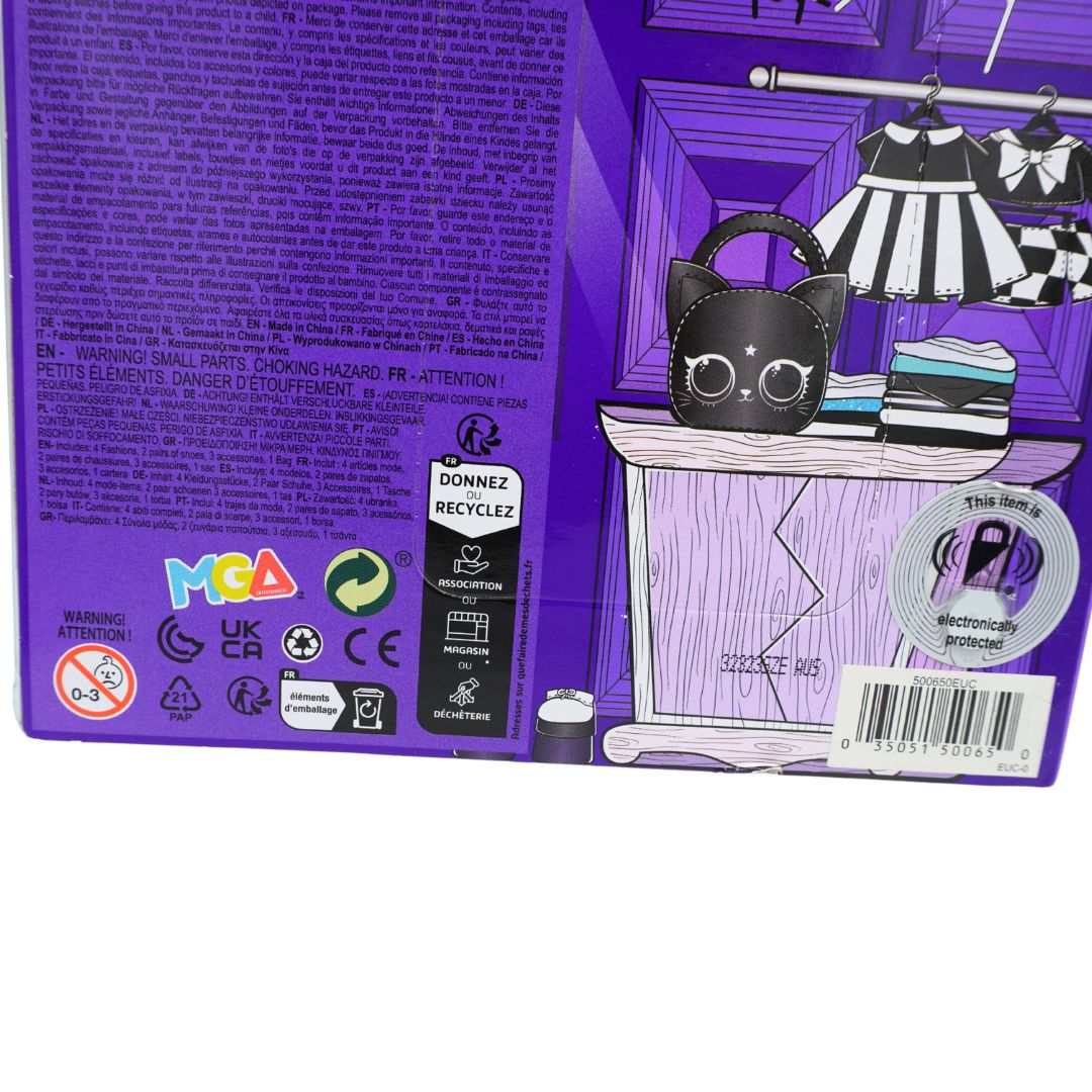 The back of a purple toy packaging box featuring safety regulations, recycling logos, and an illustration of a black cat wearing a striped dress in front of a wardrobe.