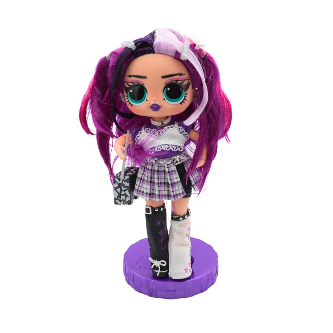 A doll with long purple and black pigtails, wearing a purple plaid dress, black and white thigh-high boots, and holding a black-and-white patterned purse, standing on a purple circular base against a white background.