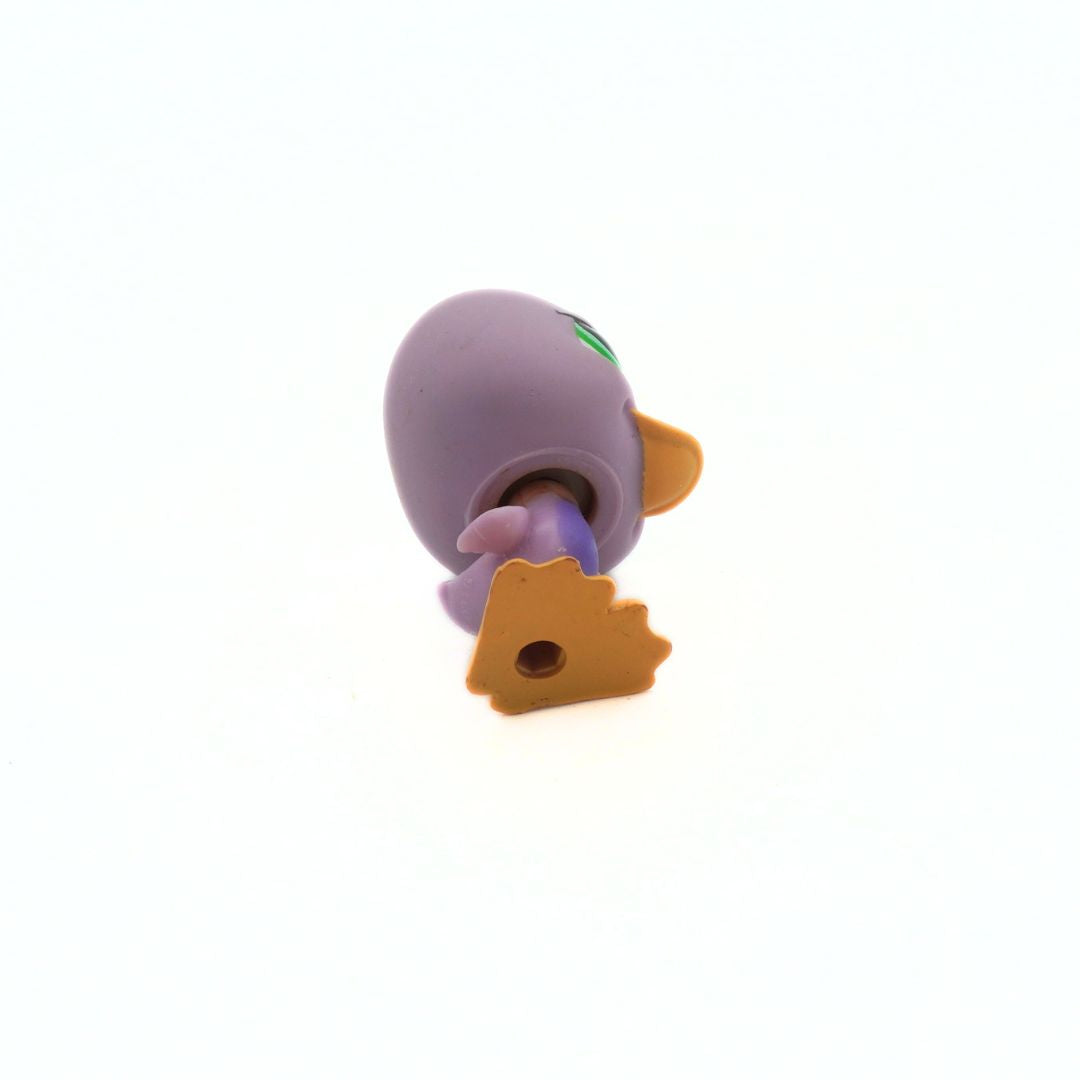 Purple and orange toy figure on a white background