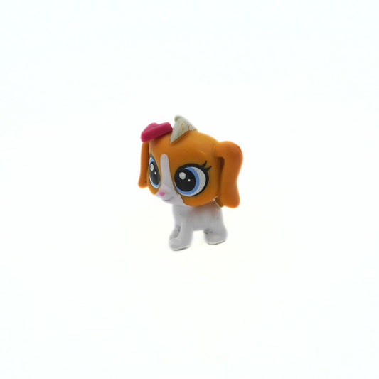 Small toy figure with orange hair and a white body on a white background
