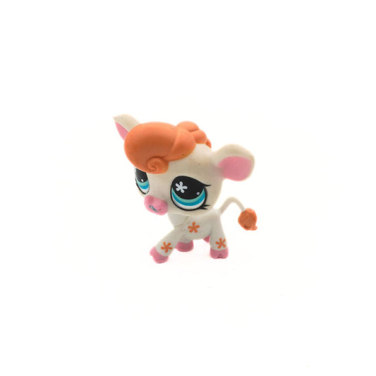 Toy figure with orange hair and blue eyes on a white background