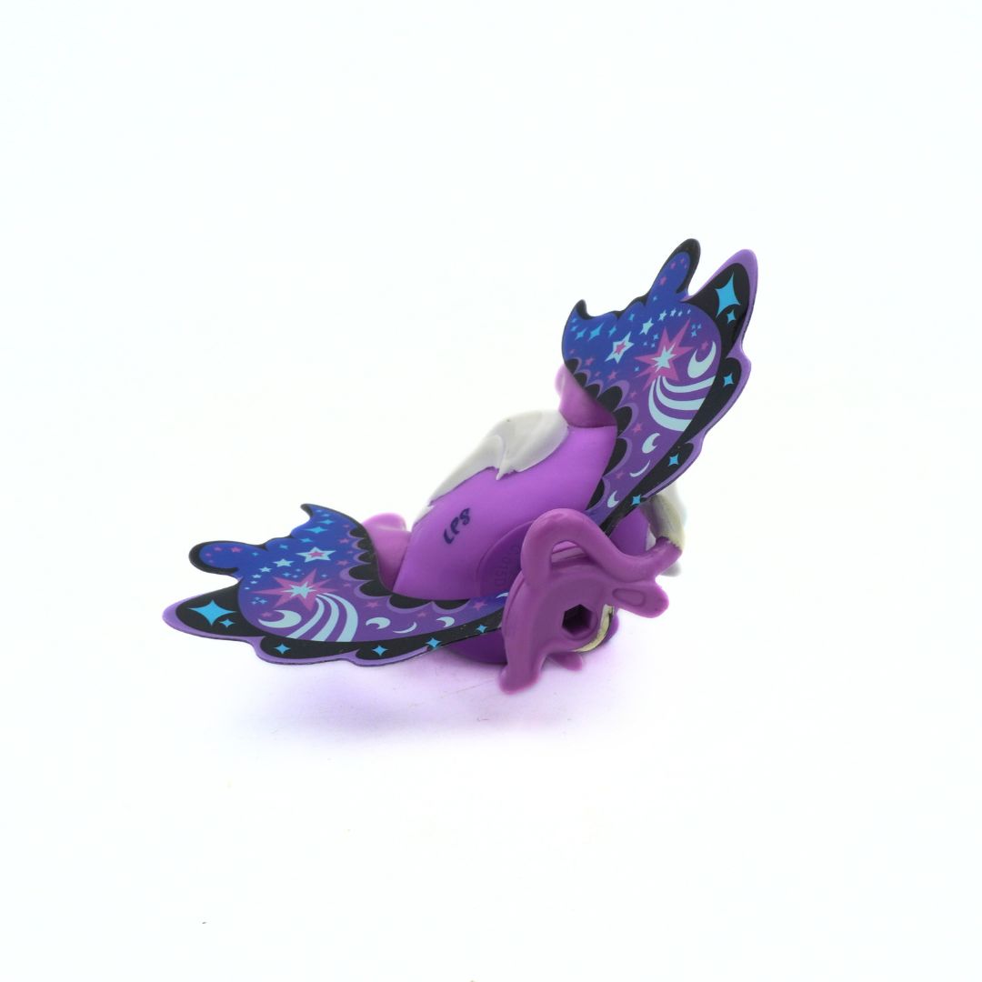 Purple toy vehicle with butterfly wings on a white background
