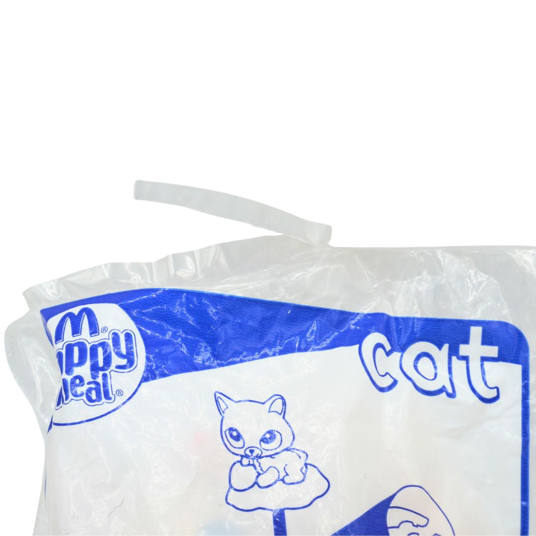 Happy Meal toy of a Littlest Pet Shop cat packaging with tear