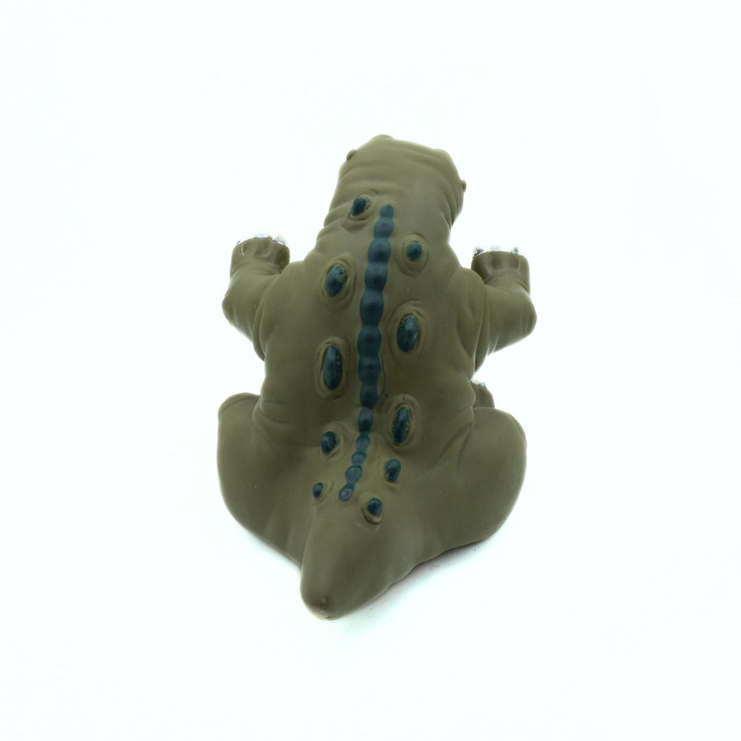 Toy figure of a creature with blue accents on a white background