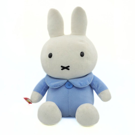 Plush toy rabbit in a blue outfit on a white background
