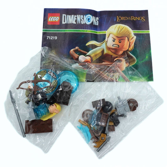 LEGO Dimensions Lord of the Rings set 71219, showing the original instruction booklet and two clear plastic bags containing the unassembled toy bricks and accessories on a white background.