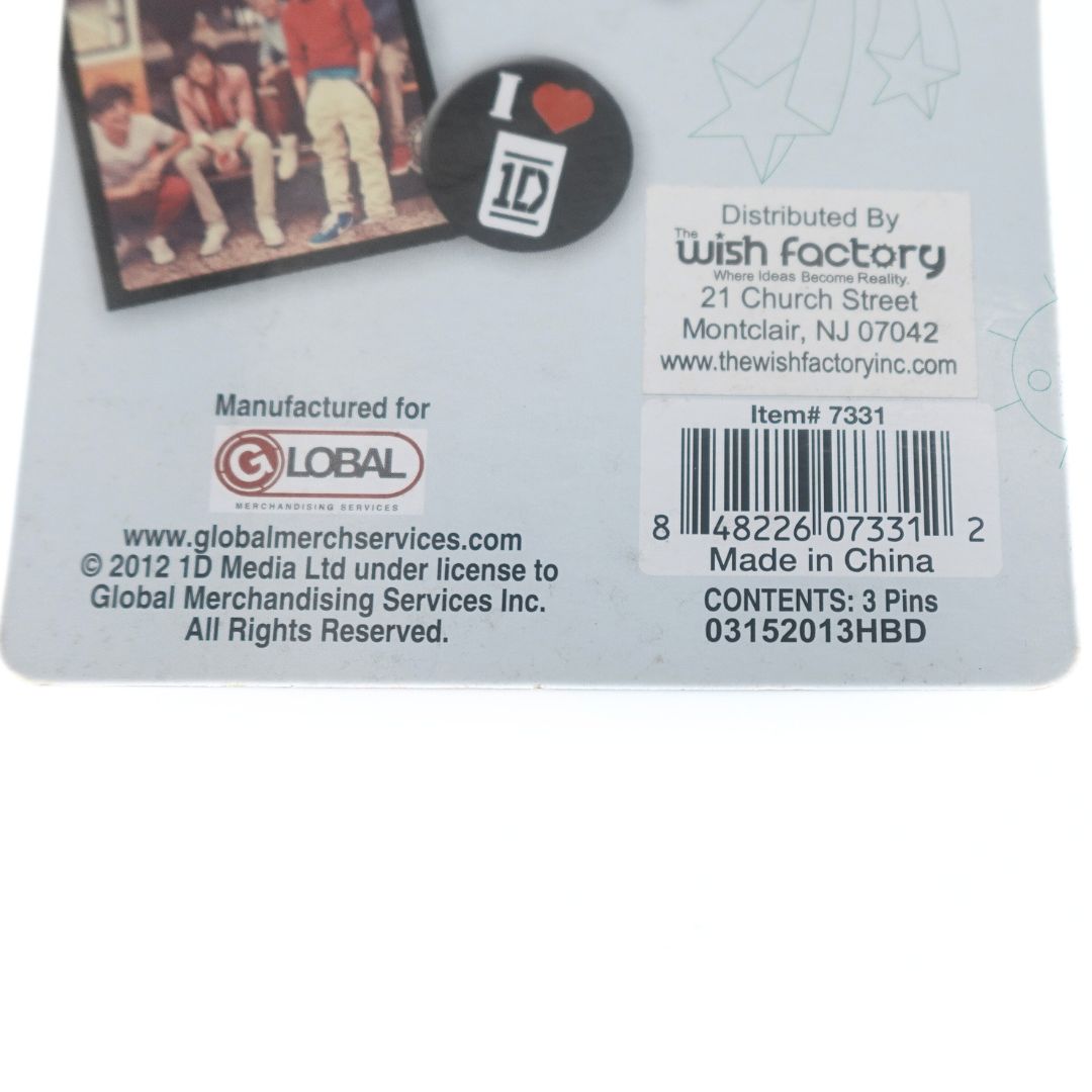 Closeup of the barcode and branding information on a 2012 One Direction Liam Payne pin set