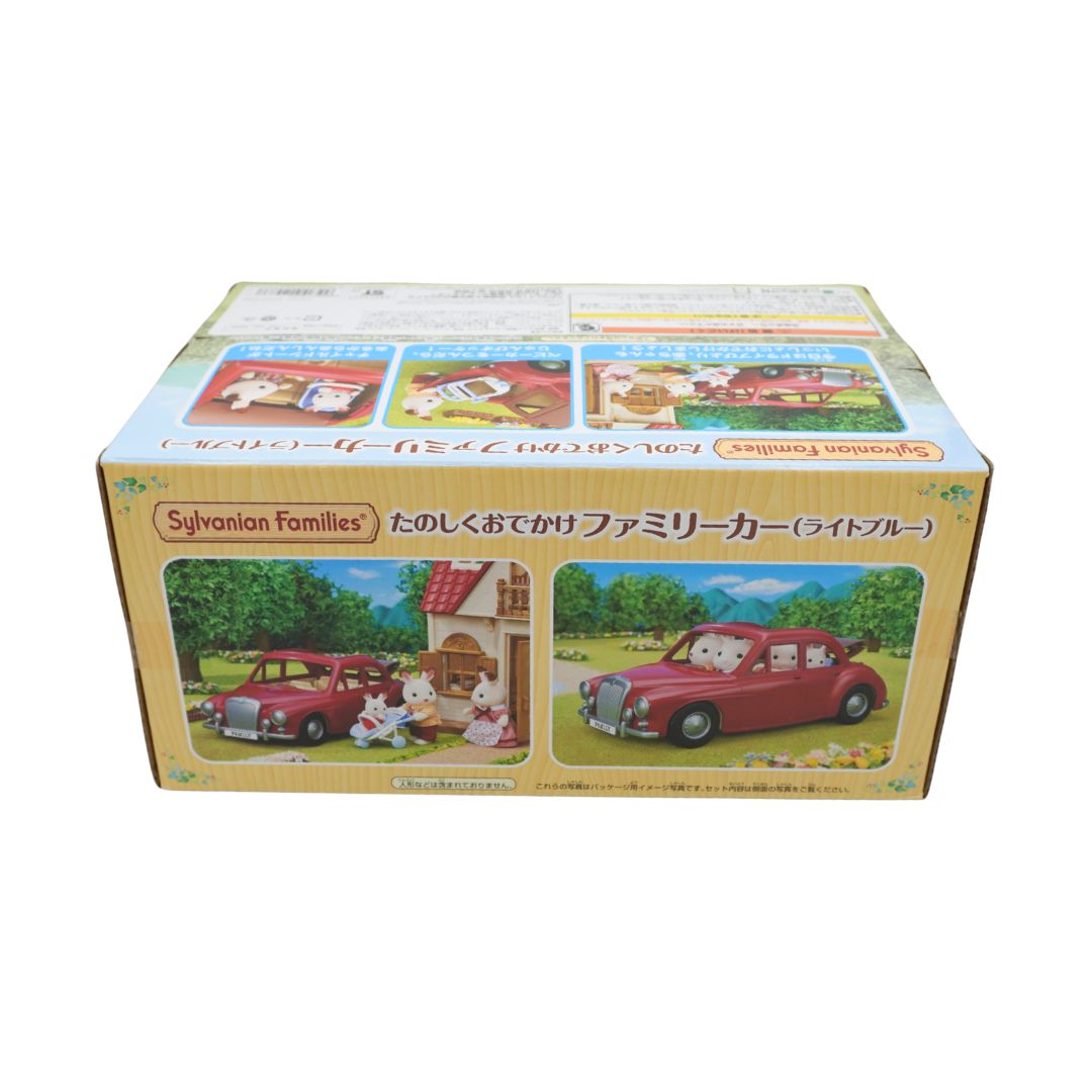 Sylvian Families toy family car set in its original Japanese box packaging, featuring a red car and illustrations of a family home and garden scenes.