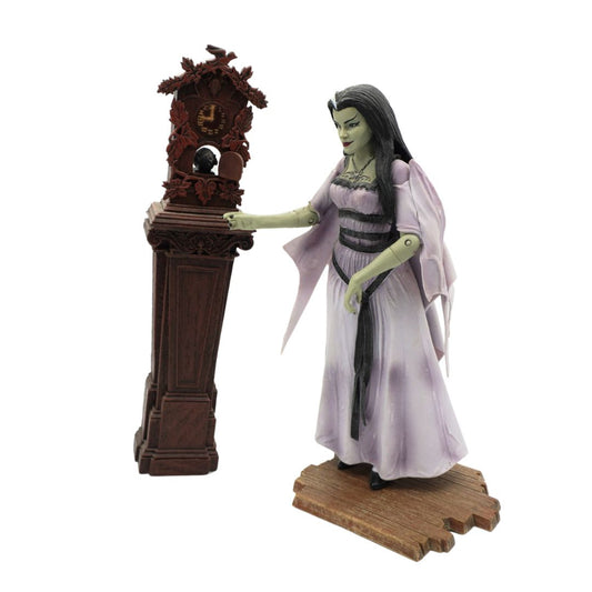A gothic figurine of a woman in a lavender gown interacting with a dark brown carved grandfather clock on a pedestal, set against a plain white background.