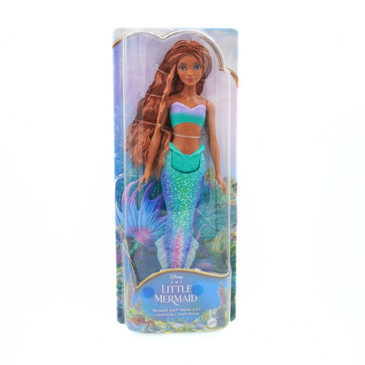 Mermaid doll in packaging with 'The Little Mermaid' branding on a white background