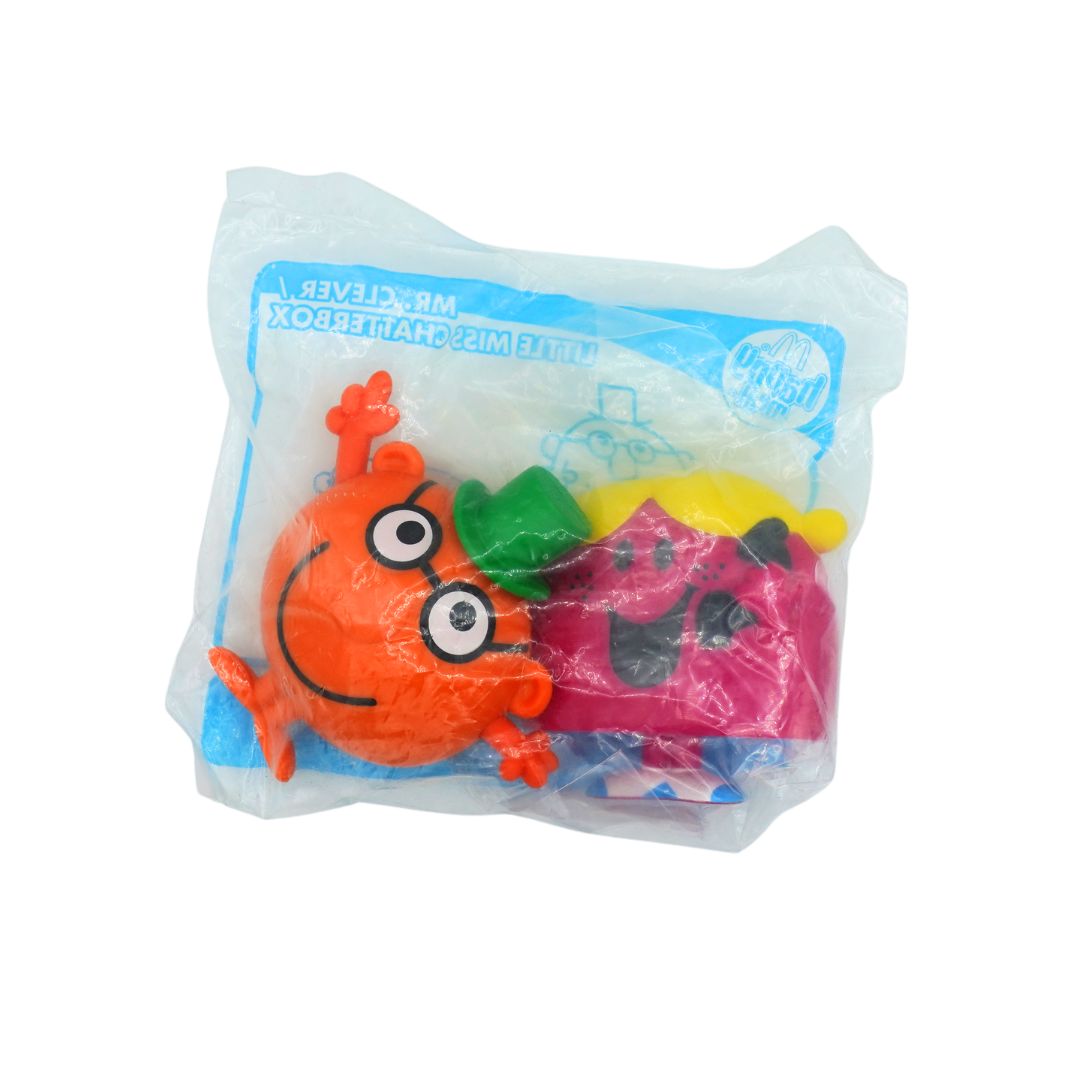 A packaged Happy Meal toys, sealed in clear plastic packaging featuring Mr Clever and Little Miss Chatterbox
