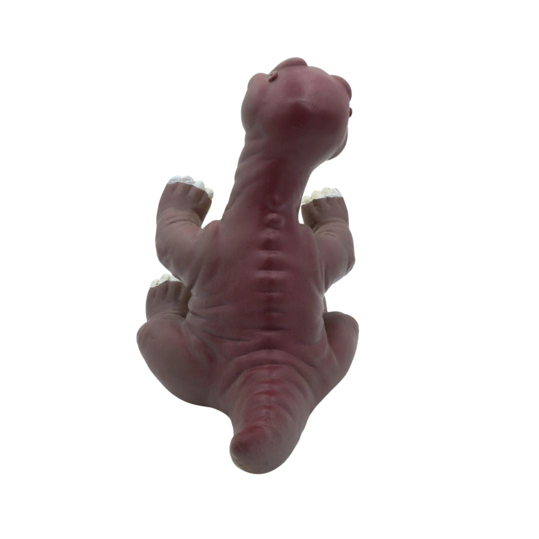 Rubber dinosaur toy on a white background