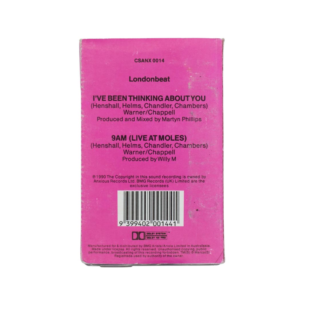 The back of a pink cassette sleeve for Londonbeat's '9AM (Live at Moles)', featuring black text, a barcode, and release code CSANX 0014.