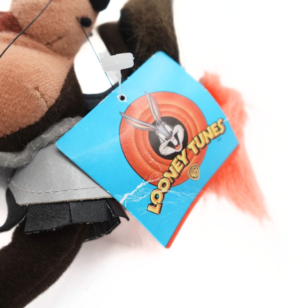 Looney Tunes tag attached to a 90's Taz Devil plush