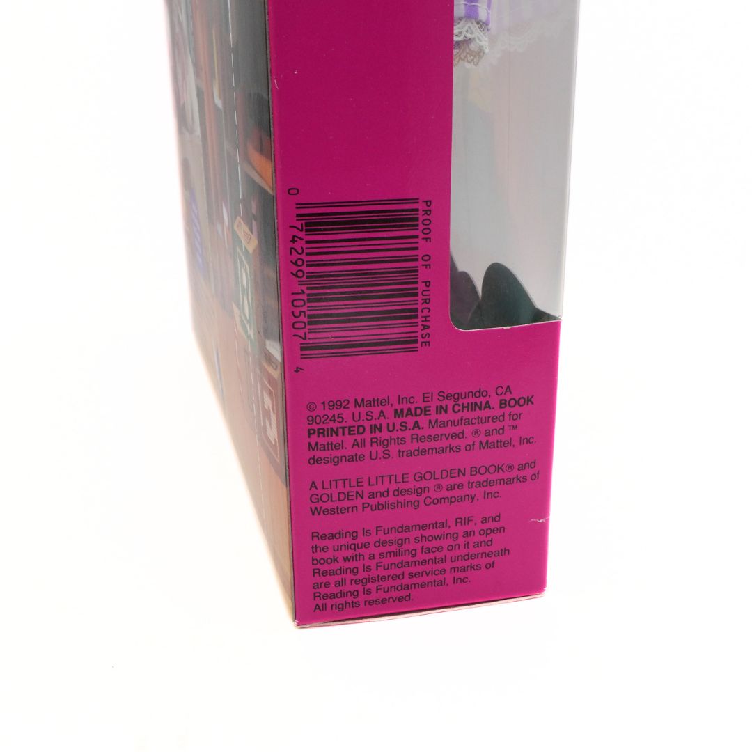 Back of a book with a pink cover and text on a white background