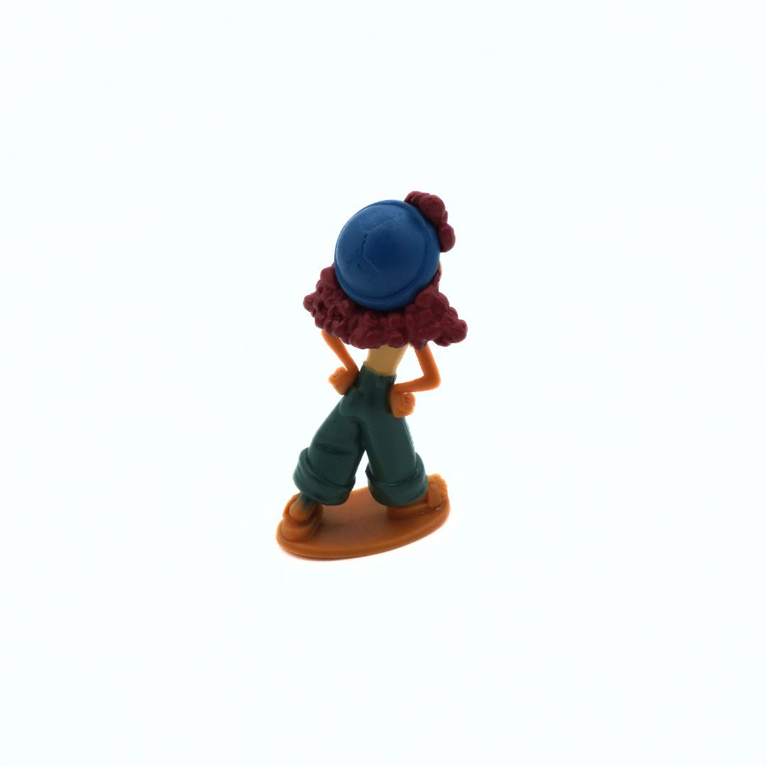 Small figurine with a blue hat and red hair on a white background
