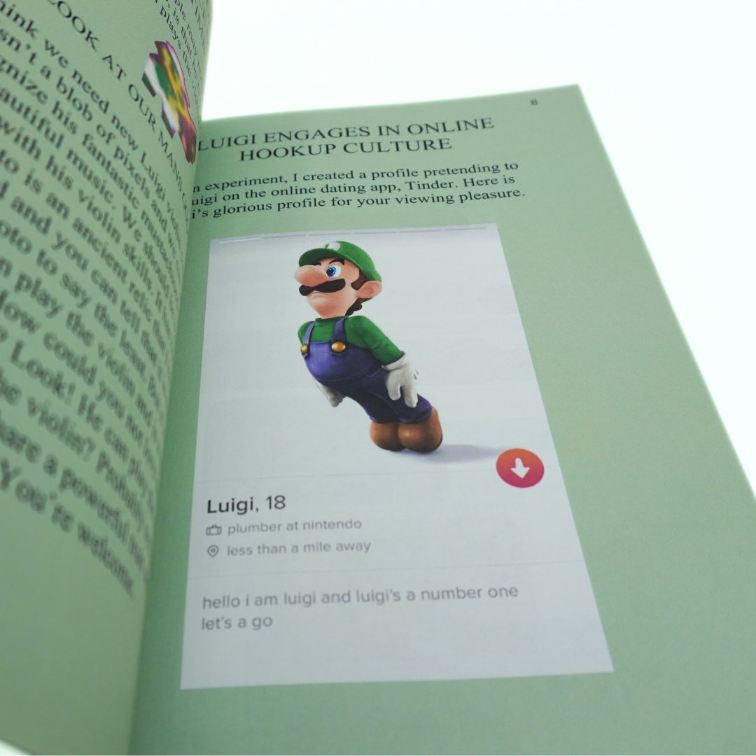 An open book or booklet showing a printed page with a photo of Luigi from the Nintendo franchise and text about online hookup culture. The page is centered against a white background, with the left page slightly visible and blurred.