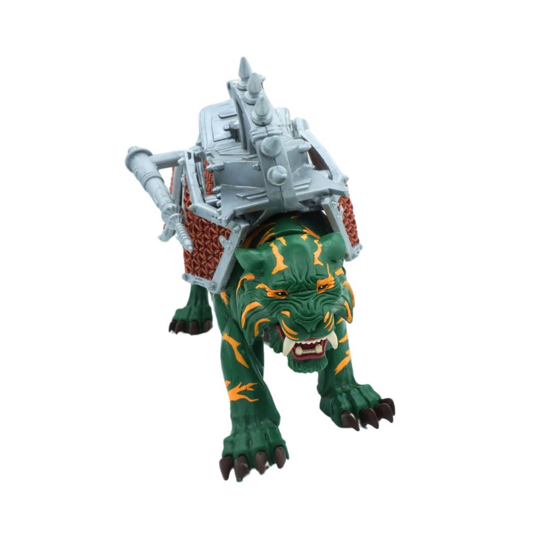 Toy figure of a green creature with armor on a white background