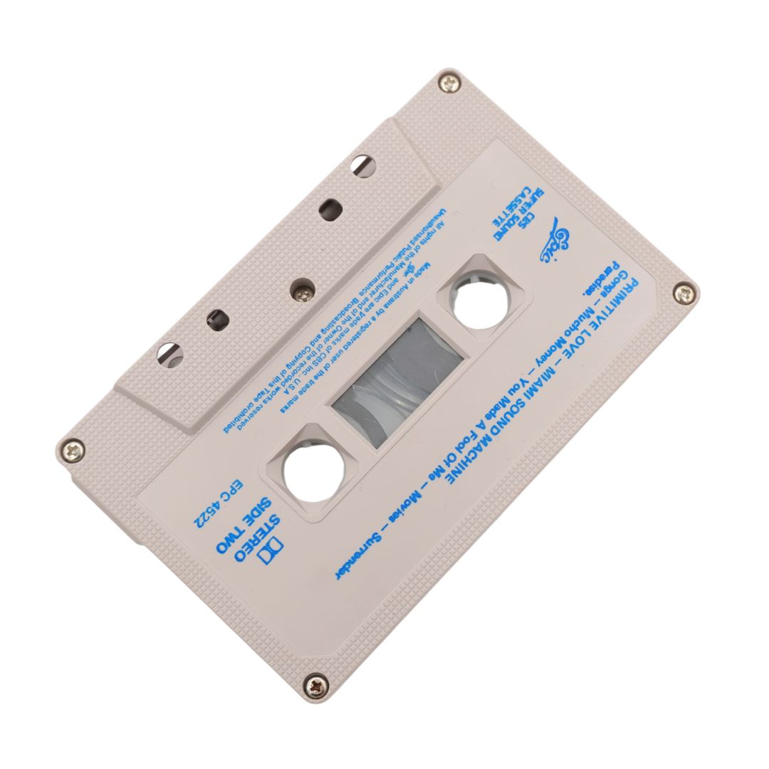 Top down image of white cassette with blue text on a white background
