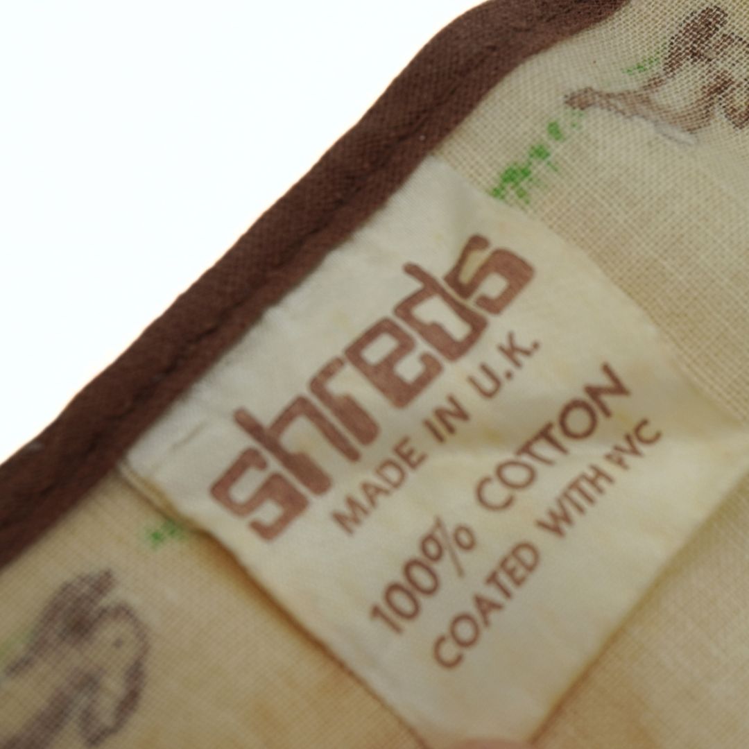 Label on a product with 'shreds' branding and text about material and origin.